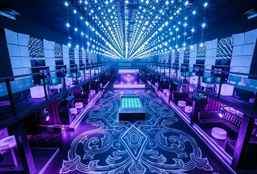 Luxury hotel interior with modern blue and purple lighting design